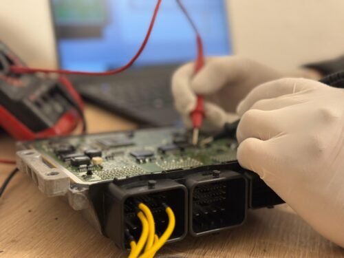 A man testing a Engine ECU Steuergerät